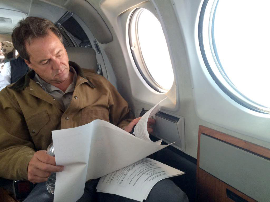 Governor Steve Bullock on board the governor's state-owned plane